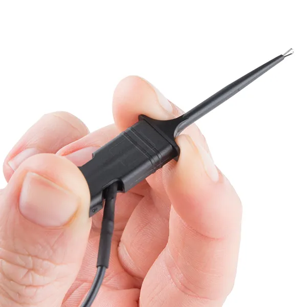 Saleae micro-gripper hook clip in use on a board, every Logic ships with 16 (Logic 8 / Pro 8) or 32 (Pro 16) of these in a carry case, available in India from GSAS